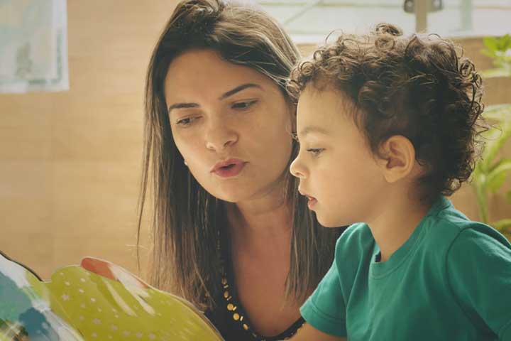 Mother and boy reading together