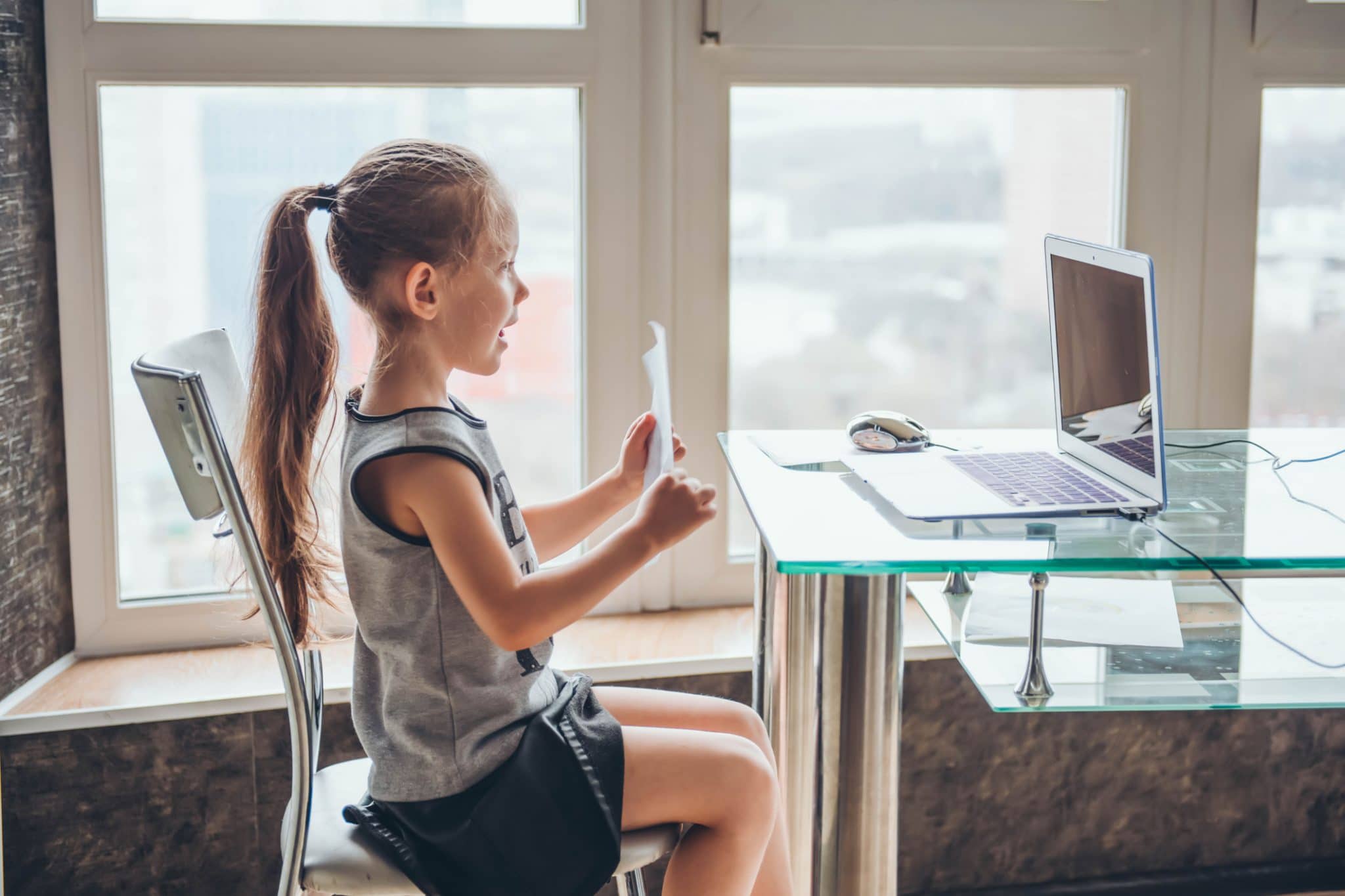 Child in virtual school at computer