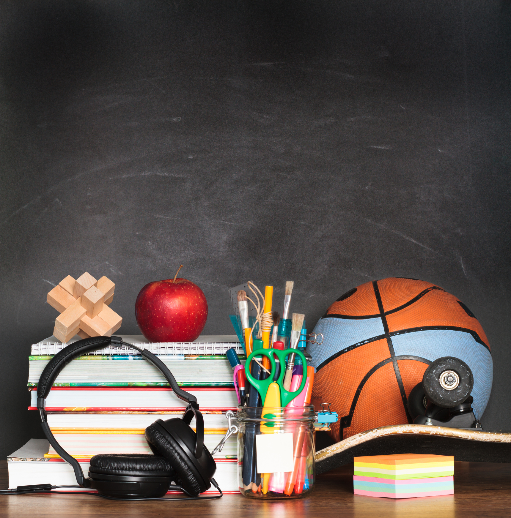 stock photo of school materials - basketball, headphones, books, pencils