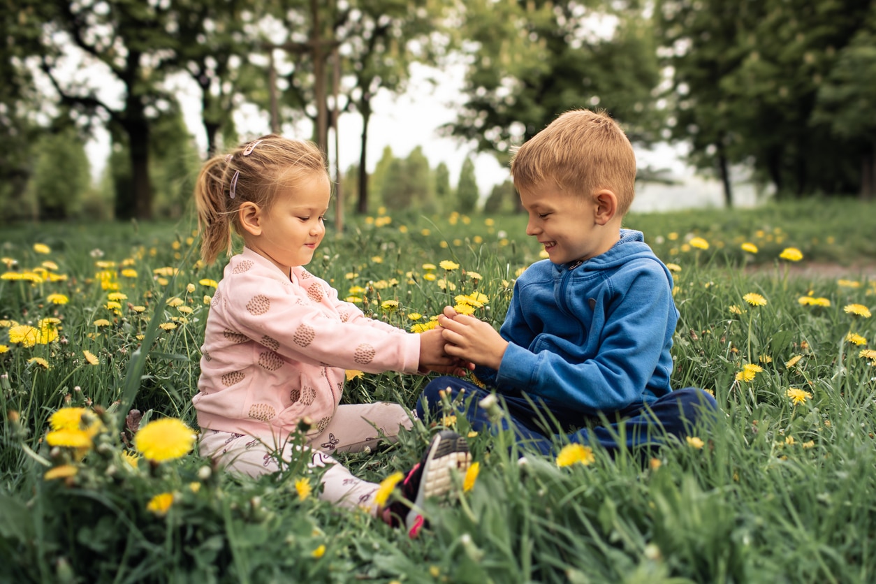 Children sharing flowers