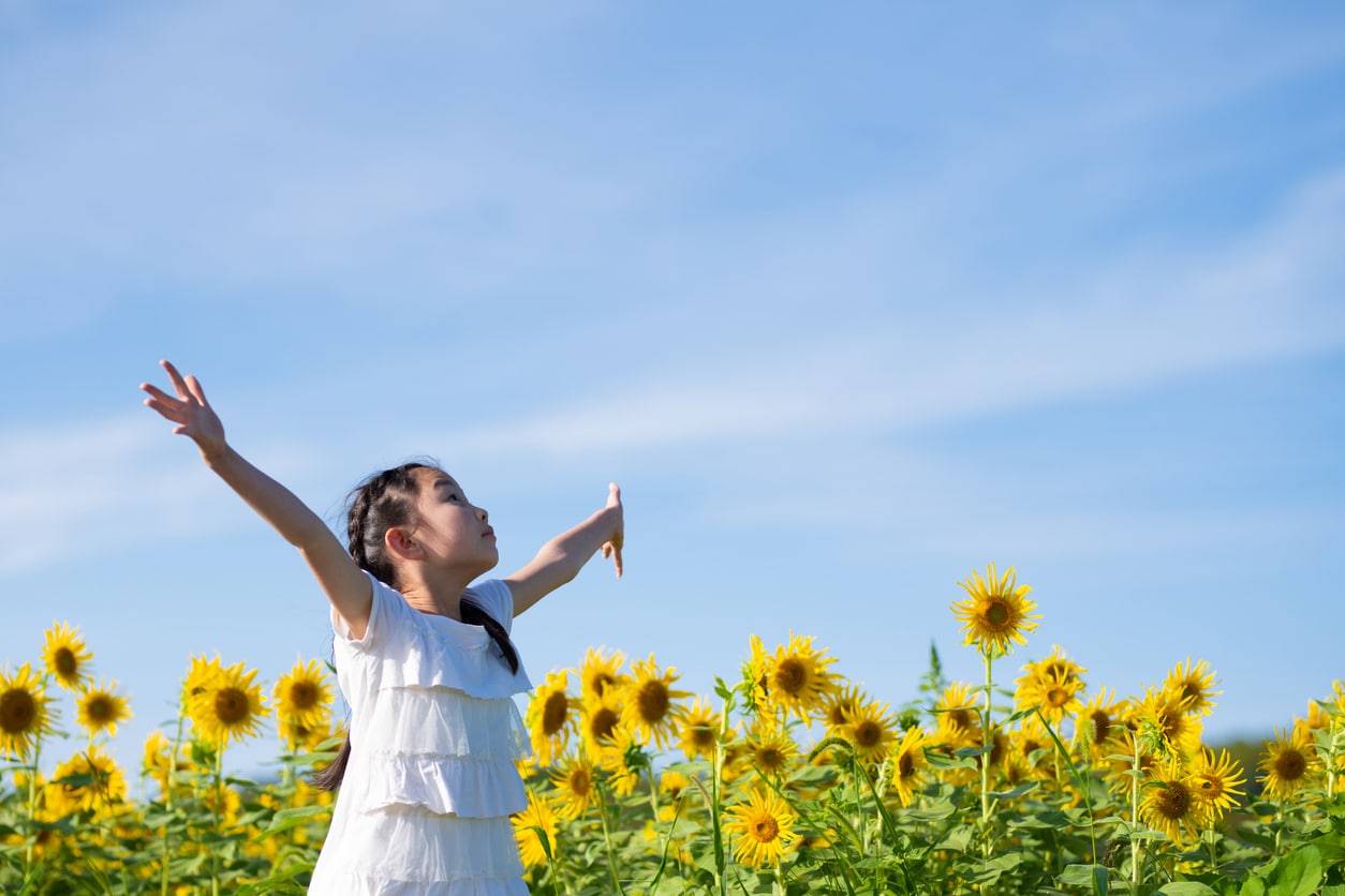 Girl in sunflower field