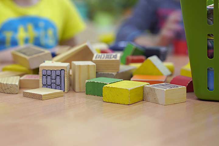 Wooden stacking blocks in a basket