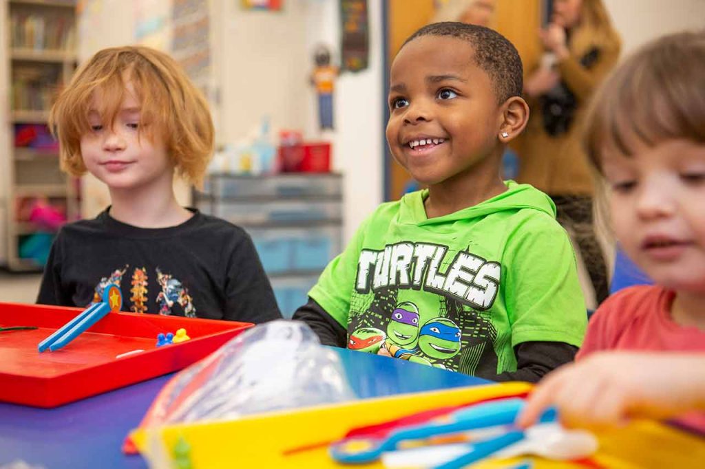 A boy focusing on the teacher's instructions